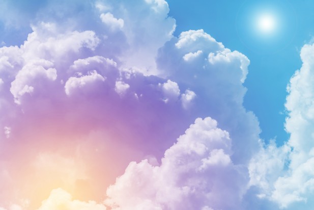 Sun and cloud background with a pastel colored