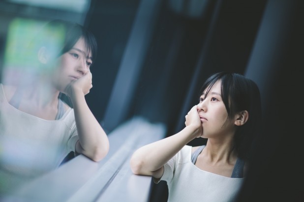 Woman thinking deeply by the window