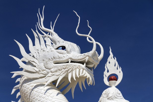 Chinese white dragon on blue background.