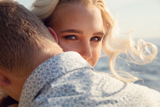 Young Unfaithful Woman Looking at Another Person