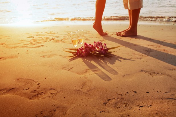 wedding on the beach, feet of romantic couple