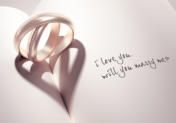 3D abstract wedding rings with heartshadow on a book middle