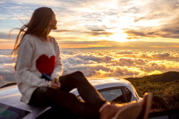 Woman enjoying beautiful cloudscape